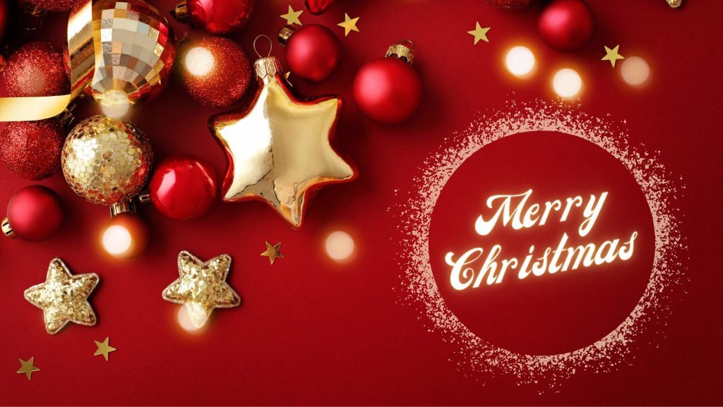 Red background with gold and red Christmas ornaments, including stars and balls. Lights and glitter surround the words Merry Christmas written in a glowing circle on the right.