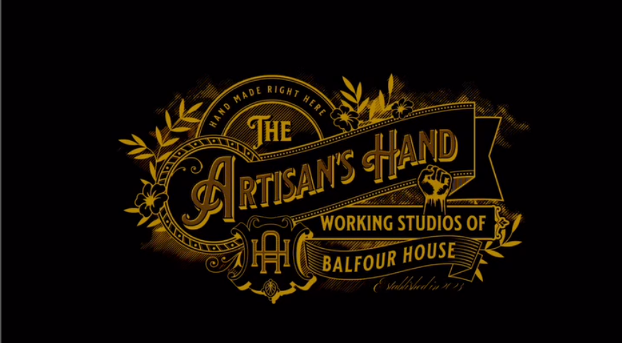 Gold ornate logo on a black background reads, “The Artisan’s Hand—Hand made right here—Working Studios of Balfour House.” Decorative leaves, flowers, and a hand holding a tool adorn the design.
