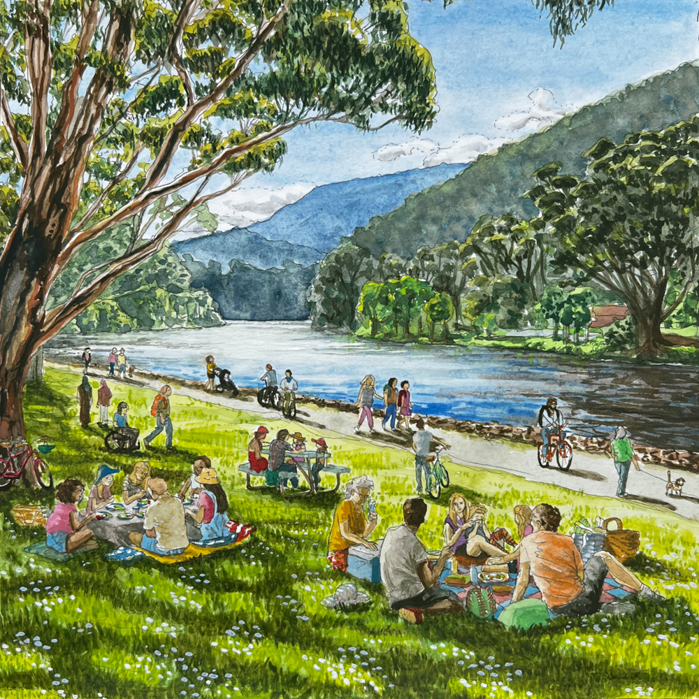 A lively riverside park scene with people having picnics on the grass, walking, cycling, and playing by the water, surrounded by trees and distant mountains under a partly cloudy sky.
